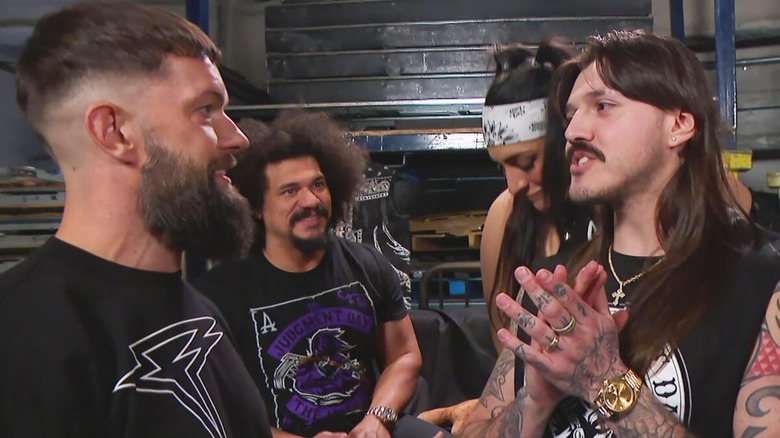 Finn Balor and Dominik Mysterio in a backstage segment with Carlito and Raquel Rodriguez in the background