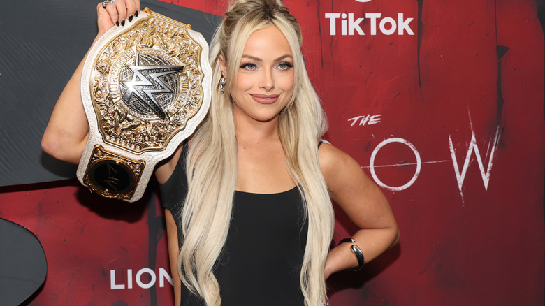 Liv Morgan holds up title belt