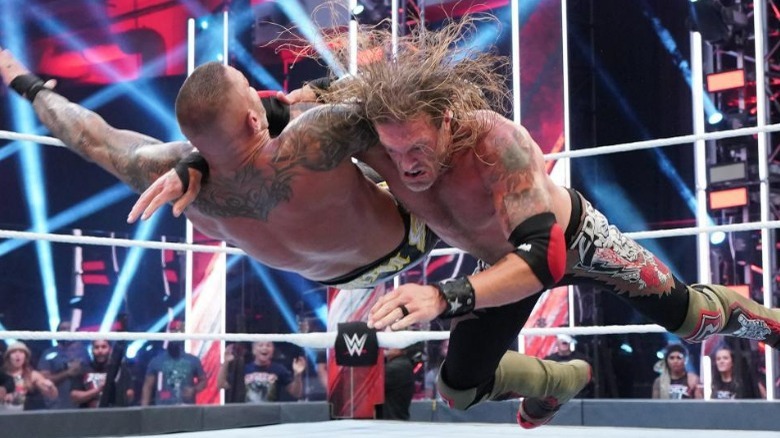 Edge slamming Randy Orton