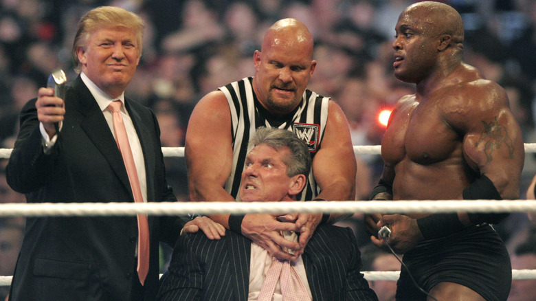 Donald Trump, Stone Cold Steve Austin, and Bobby Lashley shaving Vince McMahon's head