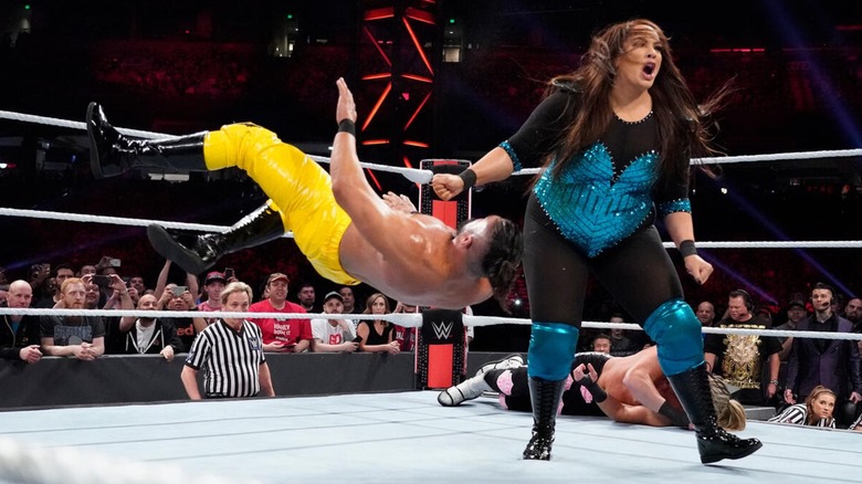 Nia Jax delivering a clothesline to Andrade