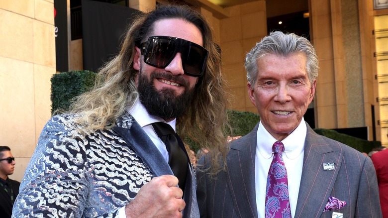 Seth Rollins poses with Michael Buffer