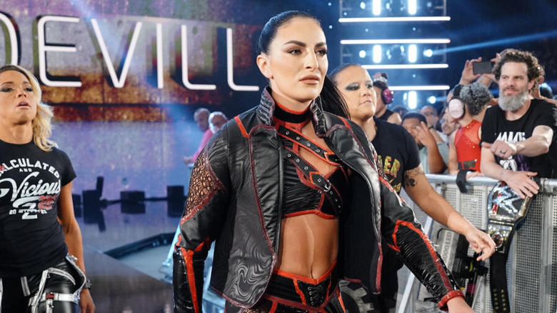 Sonya Deville makes her entrance alongside Zoey Stark and Shayna Baszler.