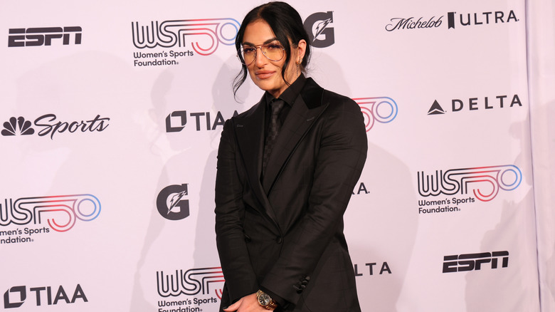 Sonya Deville posing for photo at an event