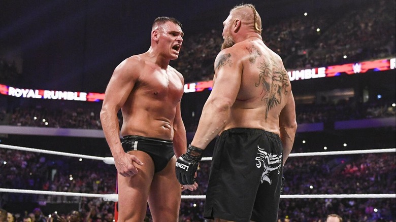 GUNTHER and Brock Lesnar facing off in the ring