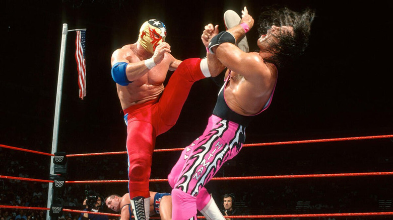 The Patriot boots Bret Hart in the face in front of the American flag