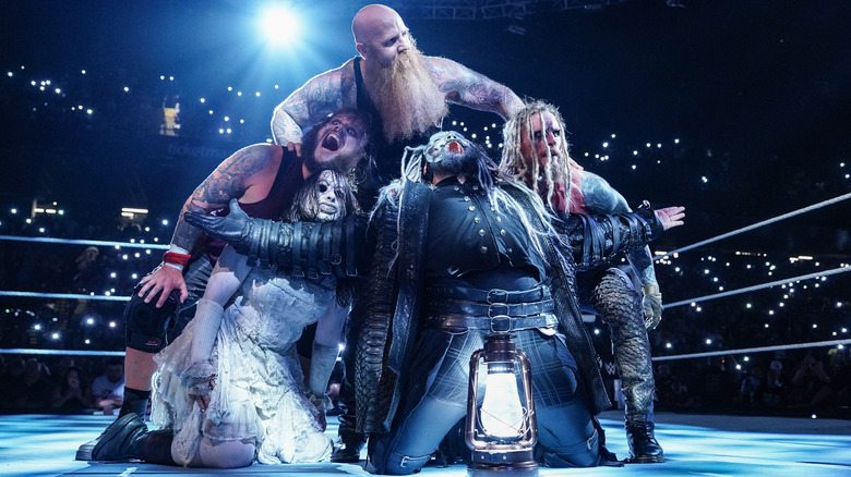 Nikki Cross, Joe Gacy, Erick Rowan, Bo Dallas, and Dexter Lumis of the Wyatt Sicks celebrate their win during Monday Night RAW at CFG Bank Arena on August 5, 2024 in Baltimore, Maryland.