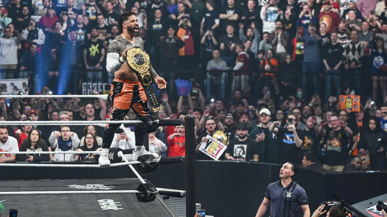 Jey Uso posing with the WWE Heavyweight Championship