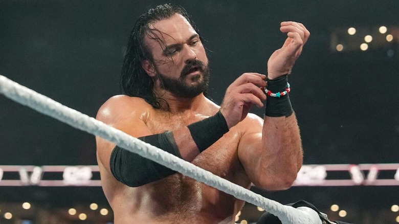 Drew McIntyre puts CM Punk's beaded friendship bracelet around his wrist