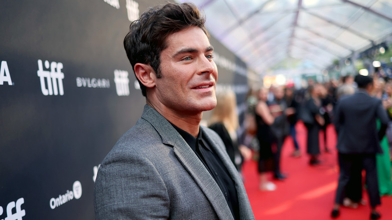 Zac Efron stopping on the red carpet