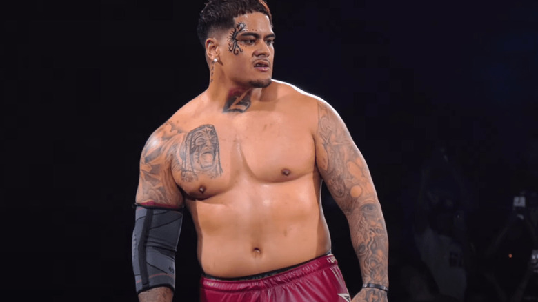 Zilla Fatu stands on the turnbuckle