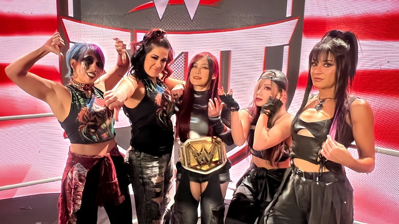 Members of Damage CTRL pose for a photo backstage at WWE Raw